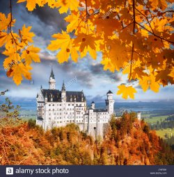 famous-neuschwanstein-castle-in-bavaria-with-autumn-leaves-germany-JY6Y9A.jpg